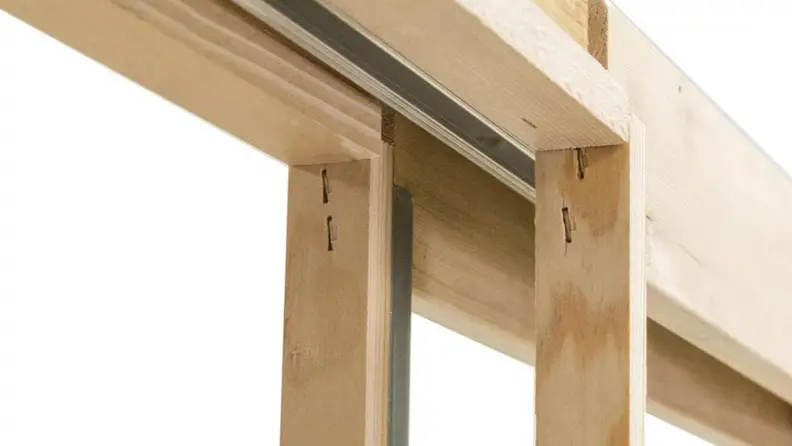 Close up of a wooden door frame made of 2x4s.