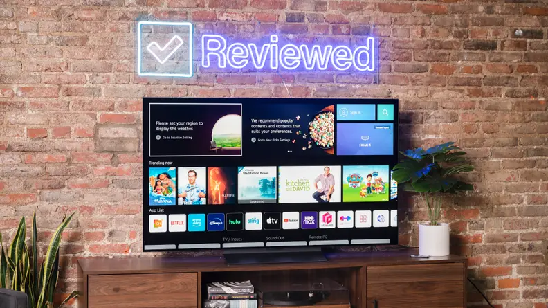 The LG C2 OLED TV displaying its smart platform's home screen in a living room setting