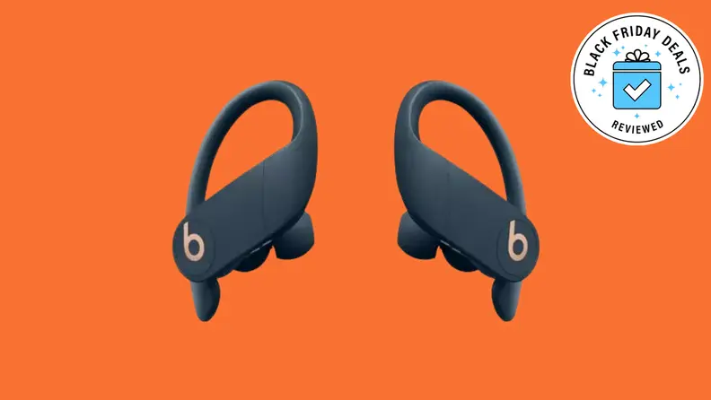 A pair of Powerbeats Pro wireless earphones with the Black Friday Deals Reviewed badge in front of a colored background.