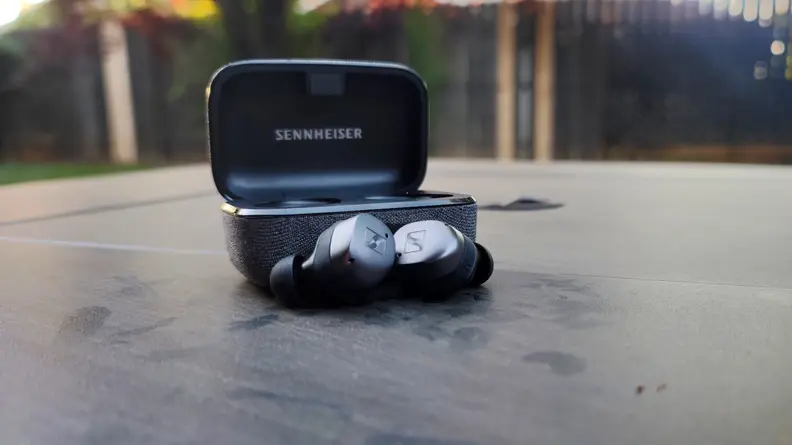 Sennheiser Momentum True Wireless 3 sitting in front of case