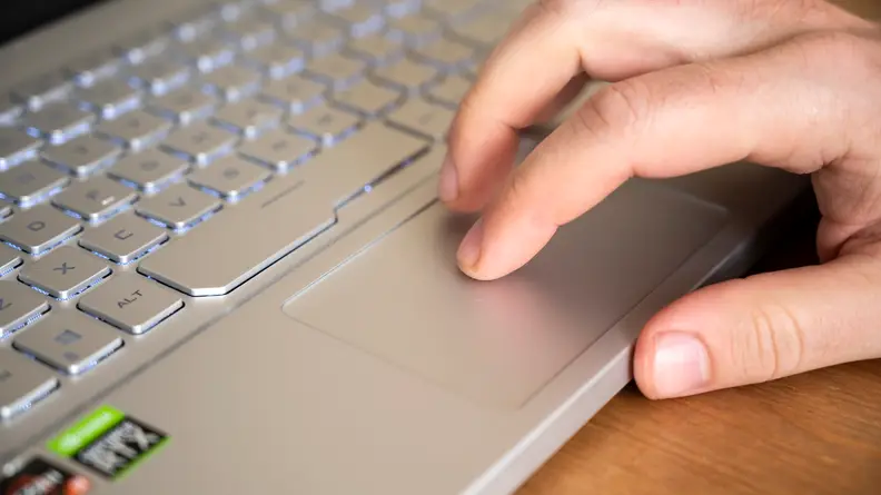 A person using the trackpad