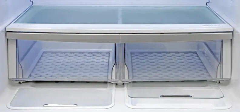 Both of the Kenmore Elite 72483's crispers are roomy and slide with ease. Plus, recessed into the bottom of the fridge compartment right in front of the crispers, you find two extra storage areas.