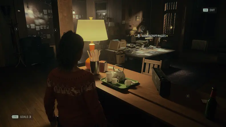 A woman in a festive sweater inside of a dimly lit lodge