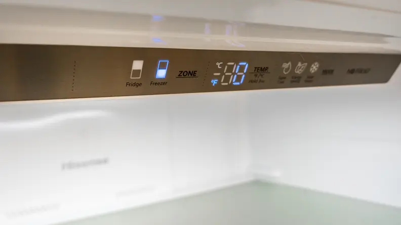 A close-up of the fridge's control panel, located along the top edge of the compartment.