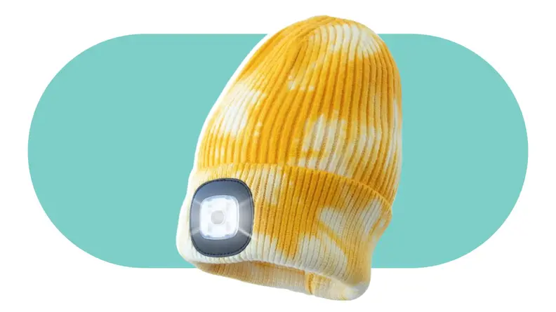A yellow tie-dyed beanie with an attached LED light.