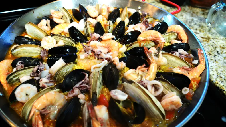 Remember to put in the clams before the mussels, as the former cooks more slowly.
