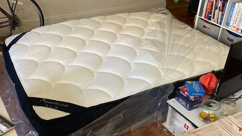 the dreamcloud mattress on the floor airing out