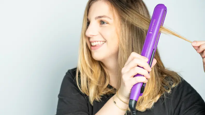 The author using the Remington flat iron.