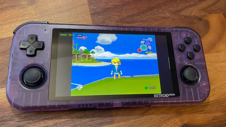 Looking at a purple gaming handheld with Legend of Zelda: Wind Waker on it