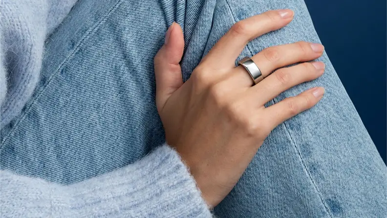 the oura ring on someone's hand