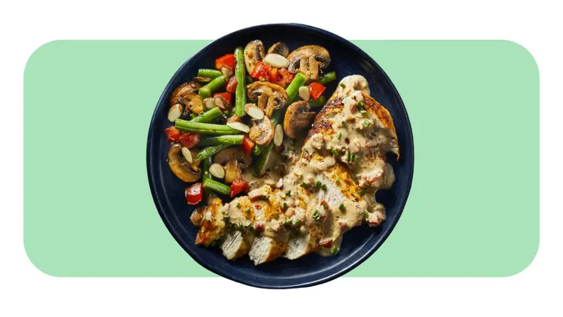 A served plate of Chicken with Creamy Bacon Sauce and veggies from the Green Chef meal kit.
