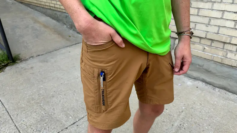 Close-up of the author wearing khaki cargo shorts with a pen tucked in the pen-pocket.