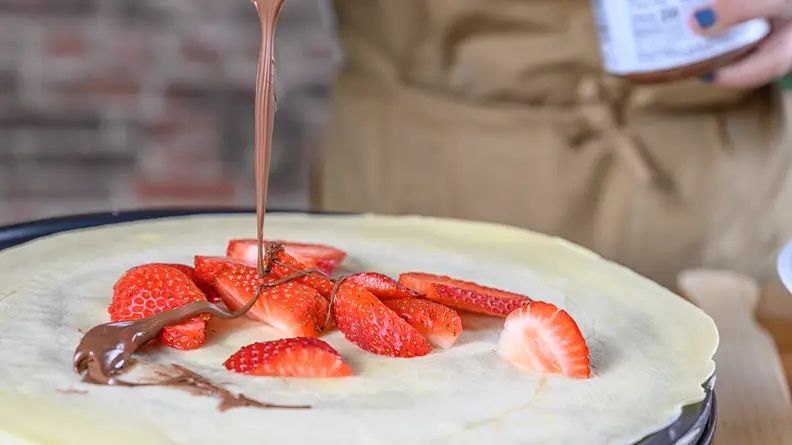 Add the fillings when the crepe is done cooking.