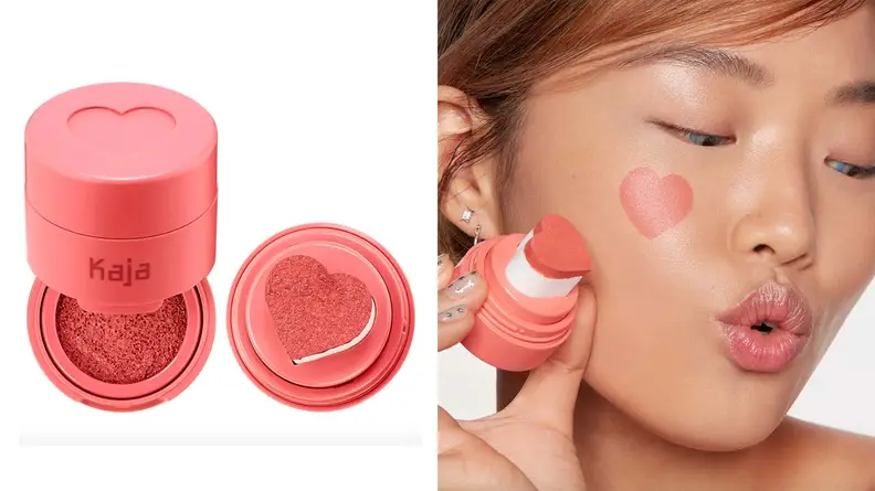 On the left: On a white background sits the Kaja Cheeky Stamp Blendable Blush in bright pink packaging. The blush is open to reveal a bright pink stamp pad and to the right of the container is a heart-shaped pink stamp. On the right: An Asian person holds a heart-shaped stamp and she has a pink heart on the apple of her cheek.