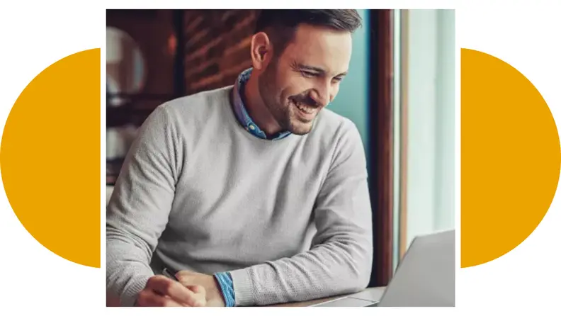A man looking at a laptop.