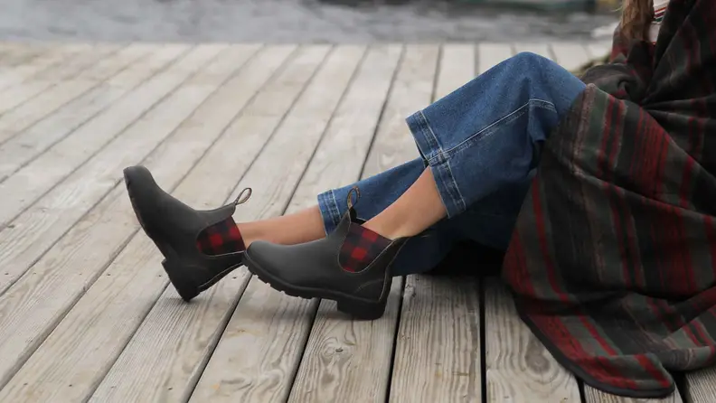 Photo of a model's legs. She wears blue jeans and Blundstone x L.L.Bean Chelsea boots.