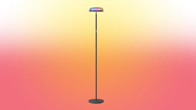 A lamp stands on a red and yellow fade background