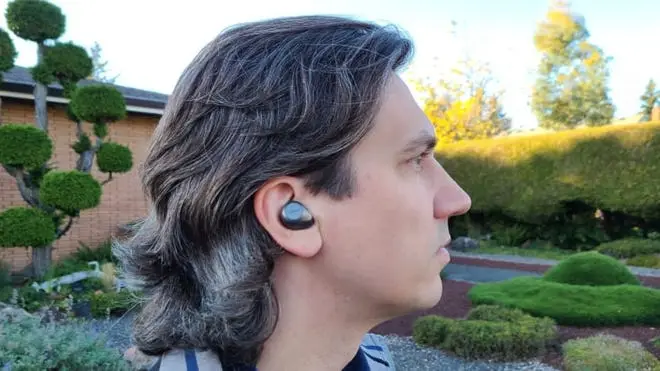 A man wearing the Jabra Elite 85t wireless earbuds.