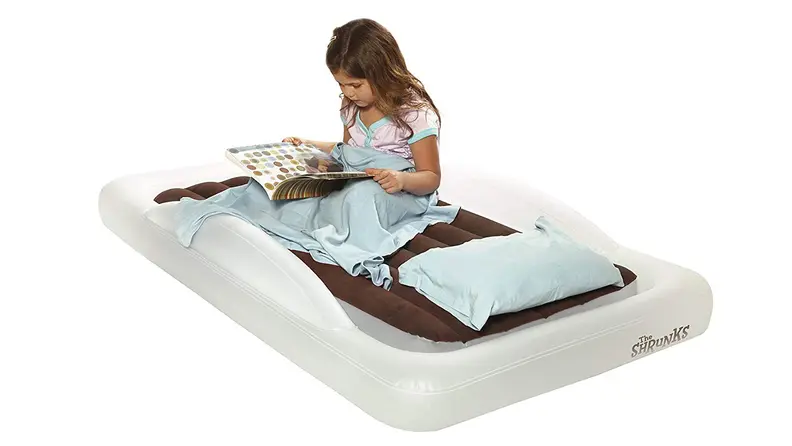 This travel bed comes with a pump and lets you tuck in sheets and blankets to feel like home.