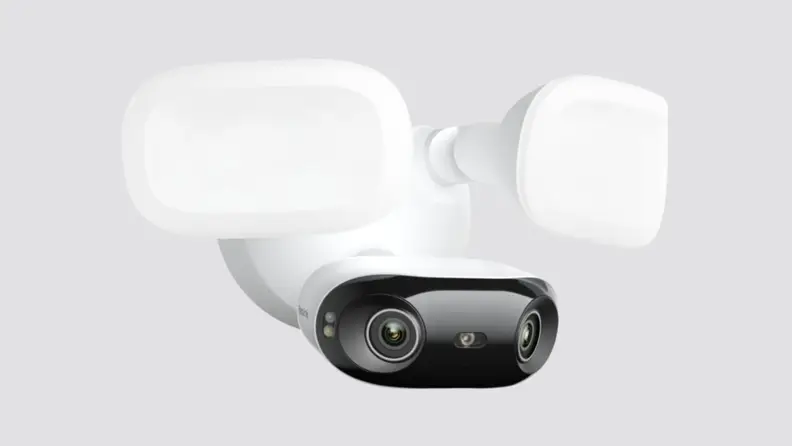 A security camera placed on a gray background