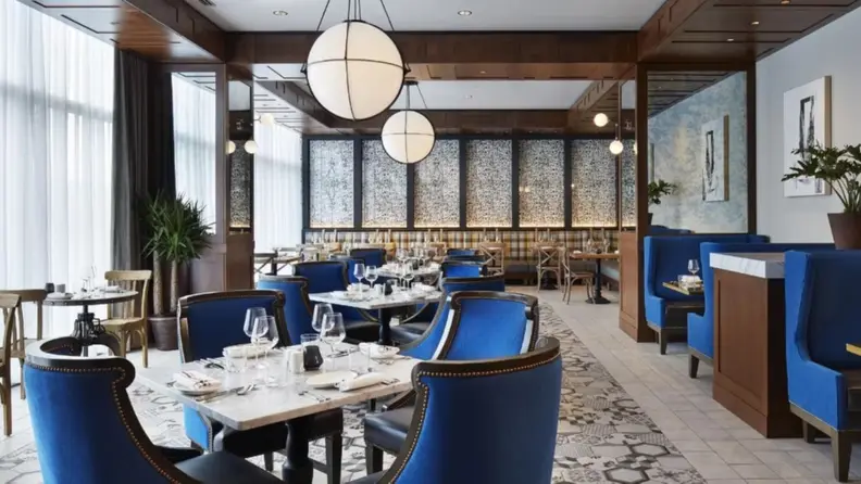 A lounge/dining area with a modern European–Mediterranean vibe