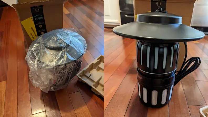 The Dynatrap insect trap outside of original packaging next to box.