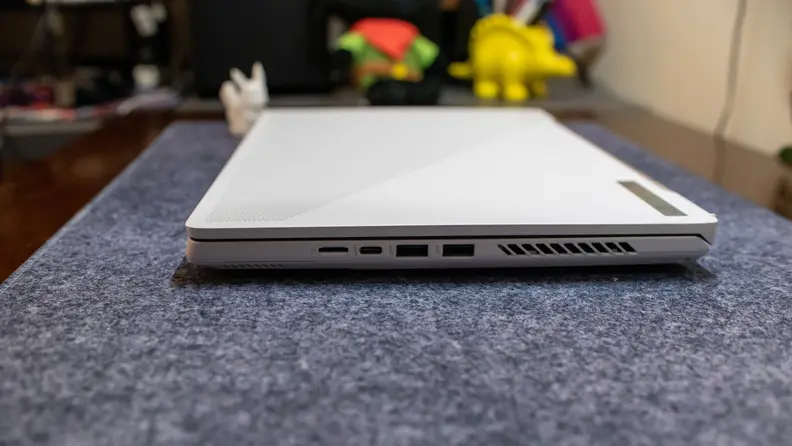 The laptop closed while sitting atop a table.