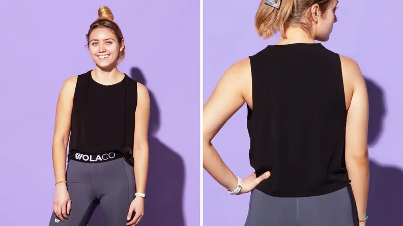 A person wearing the Wolaco Clinton muscle tank top in black.