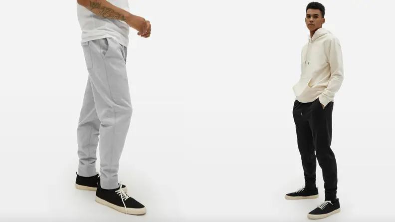 A pair of models show off Everlane-brand hoodies, sweatpants, and sneakers.