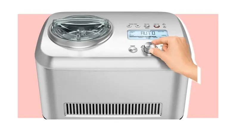 Hand adjusting settings on Breville ice cream maker
