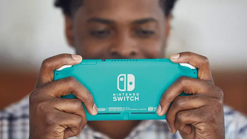 A person plays with a Nintendo DS.