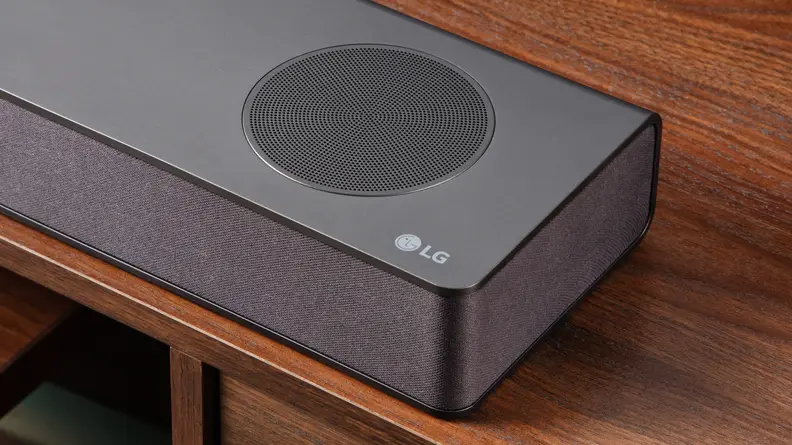 Close up of a speaker on an LG S80QY soundbar.