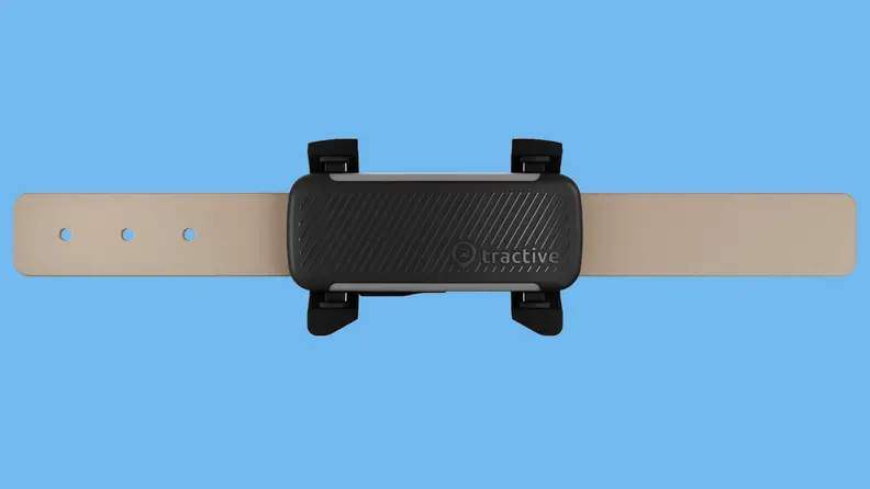 Tractive dog tracker collar on colored background
