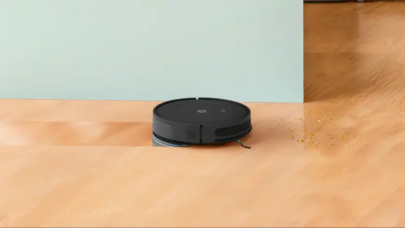 The iRobot Roomba Combo Essential mopping hardwood and vacuuming crumbs.