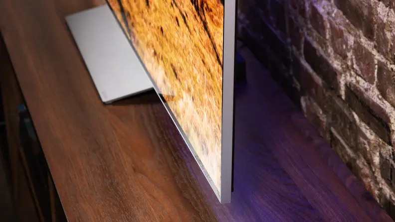 View of a flatscreen LG OLED TV with an image on display.