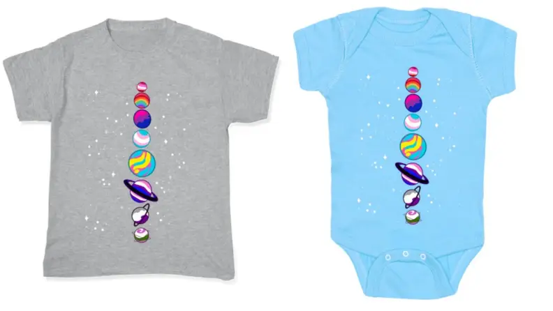 On left, gray graphic tee with LGBTQ+ planets on front. On right, blue onesie with LGBTQ+ planets on front.