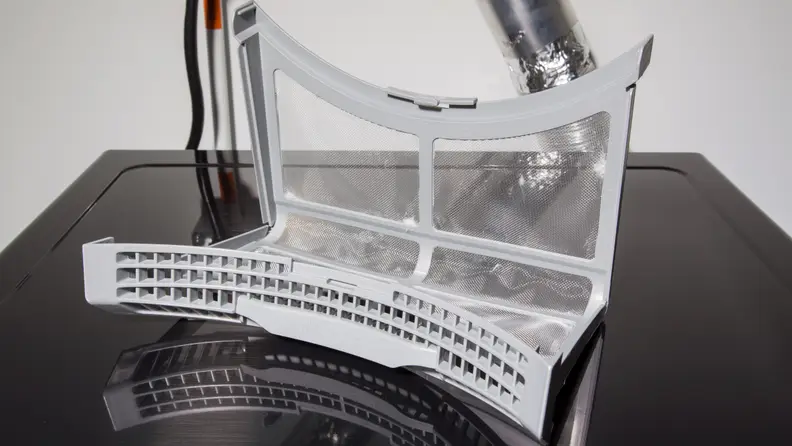 The dryer's lint trap is difficult to open
