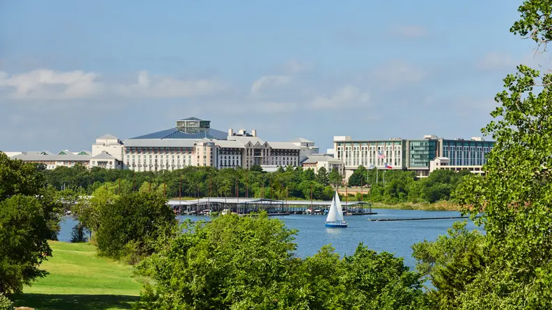 A large hotel by a lake