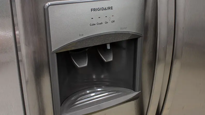 A close-up of the Frigidaire FFSS2615TS's external ice maker.