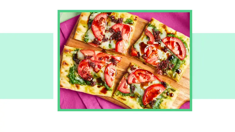 Flatbread pizza with green pesto and tomatoes