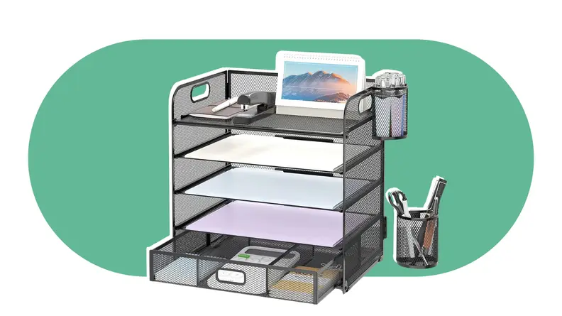 Multi-level desk organizer with paper inside and pens on top.