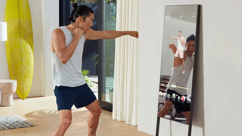 Man exercising in front of lululemon Mirror.