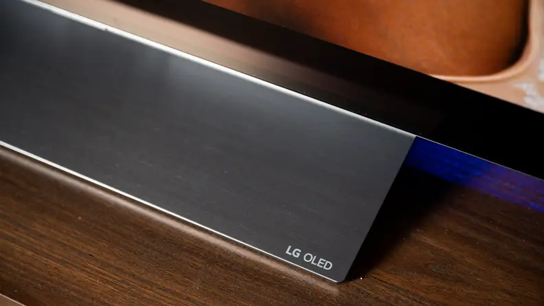 A close-up of the LG C2's stand, featuring the LG OLED insignia