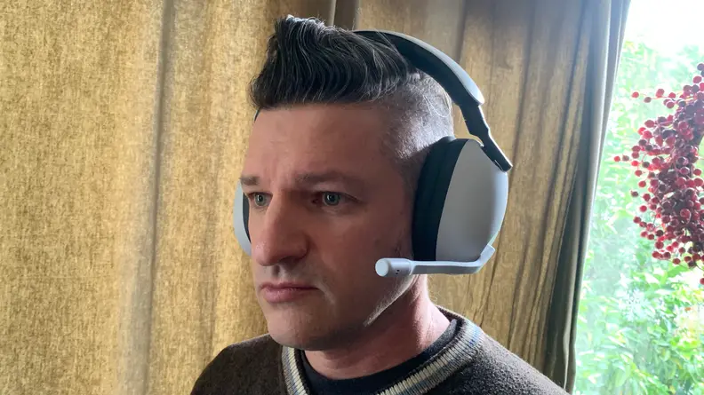 A man wearing the Sony Inzone H9.