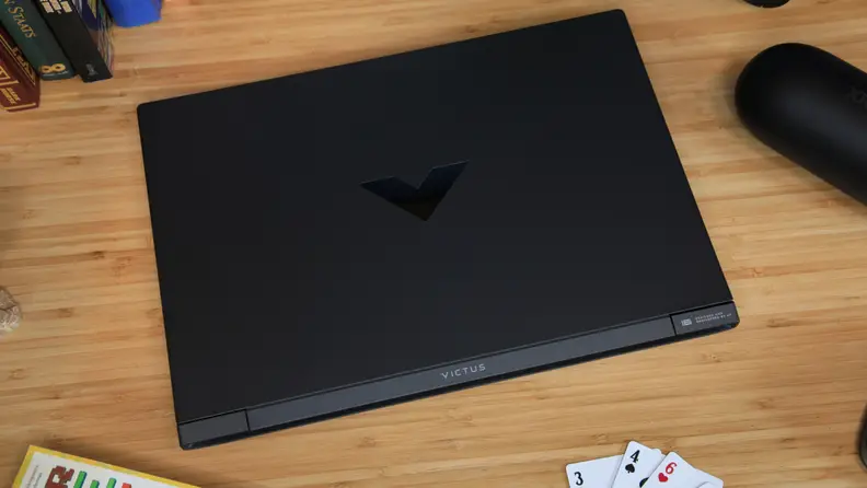 The HP Victus 16 closed atop a desk.