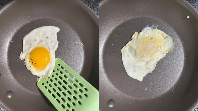 Egg being fried and flipped inside of nonstick frying pan with plastic green spatula.