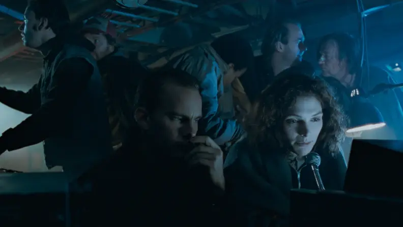 Mary Elizabeth Mastrantonio speaks into a microphone in James Cameron's 1989 film, The Abyss.