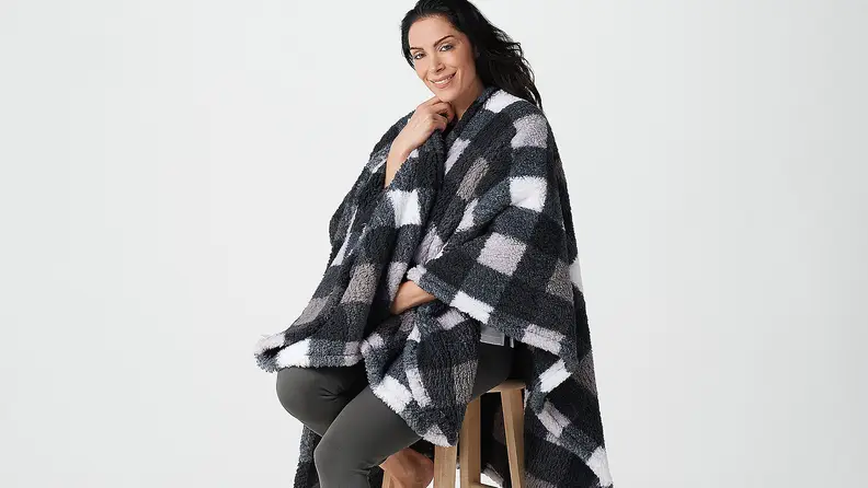 Woman wearing checkered cape