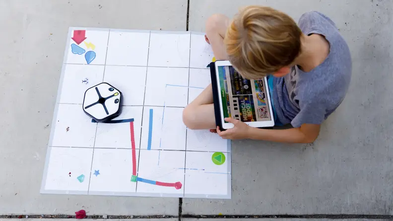 It looks like a robot vacuum, but it's actually a coding toy.