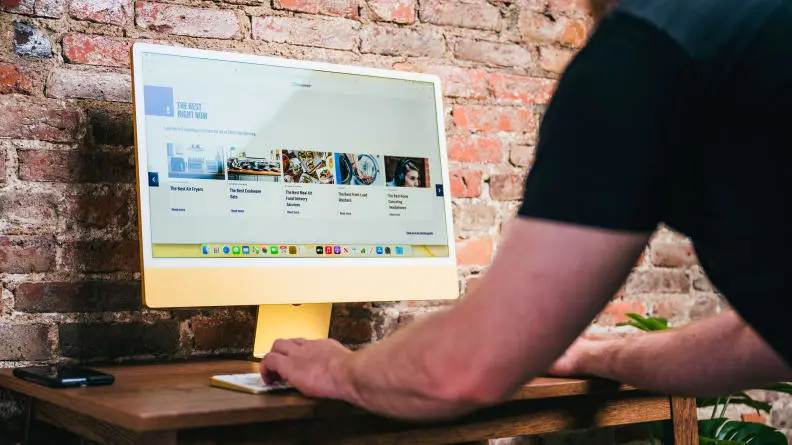 Person uses an iMac